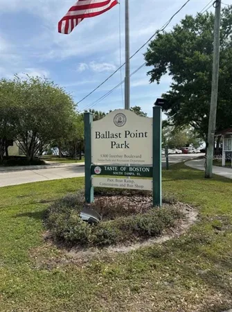 a sign board on the side of the road