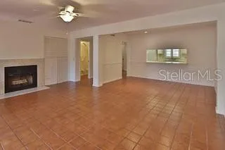 a view of an empty room with a fireplace
