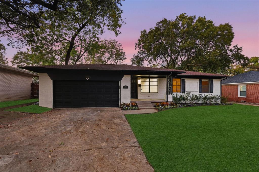 6611 Highgate Lane Dallas, TX 75214 - Photo 2 of 39 Ranch-style home with brick siding, a lawn, driveway, and an attached garage
