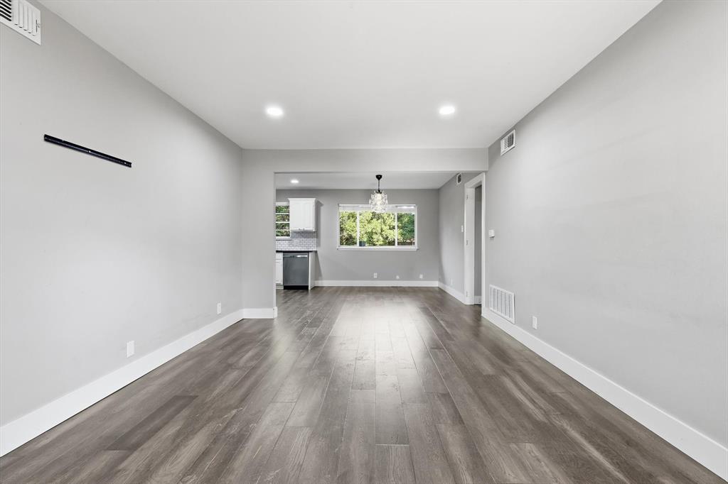 6611 Highgate Lane Dallas, TX 75214 - Photo 7 of 39 Unfurnished living room featuring recessed lighting and dark wood-style flooring