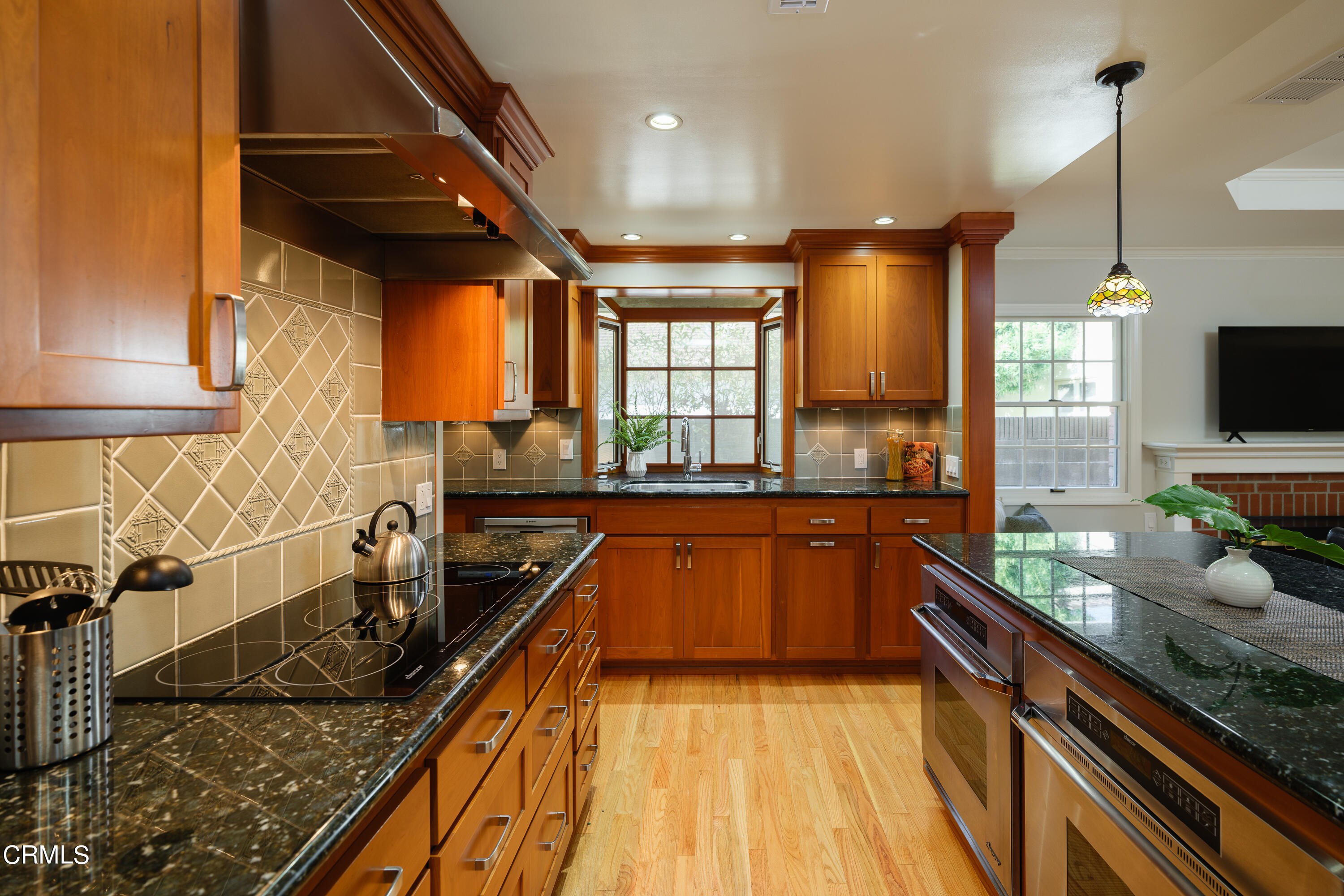 525 Verner Circle Arcadia, CA 91006 - Photo 13 of 45 a kitchen with sink a counter and cabinets