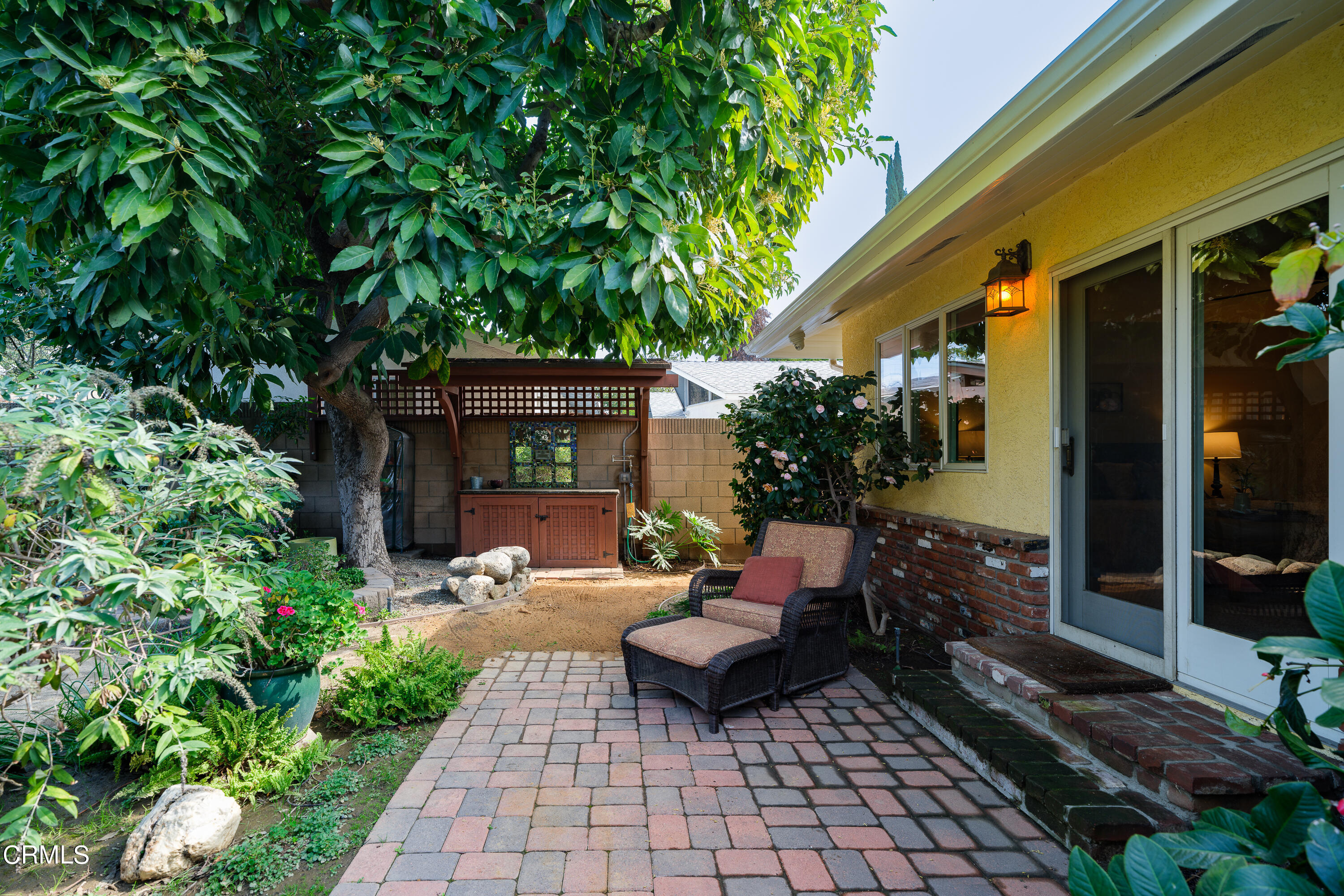 525 Verner Circle Arcadia, CA 91006 - Photo 32 of 45 a view of a patio with table and chairs potted plants and floor to ceiling window and wooden fence