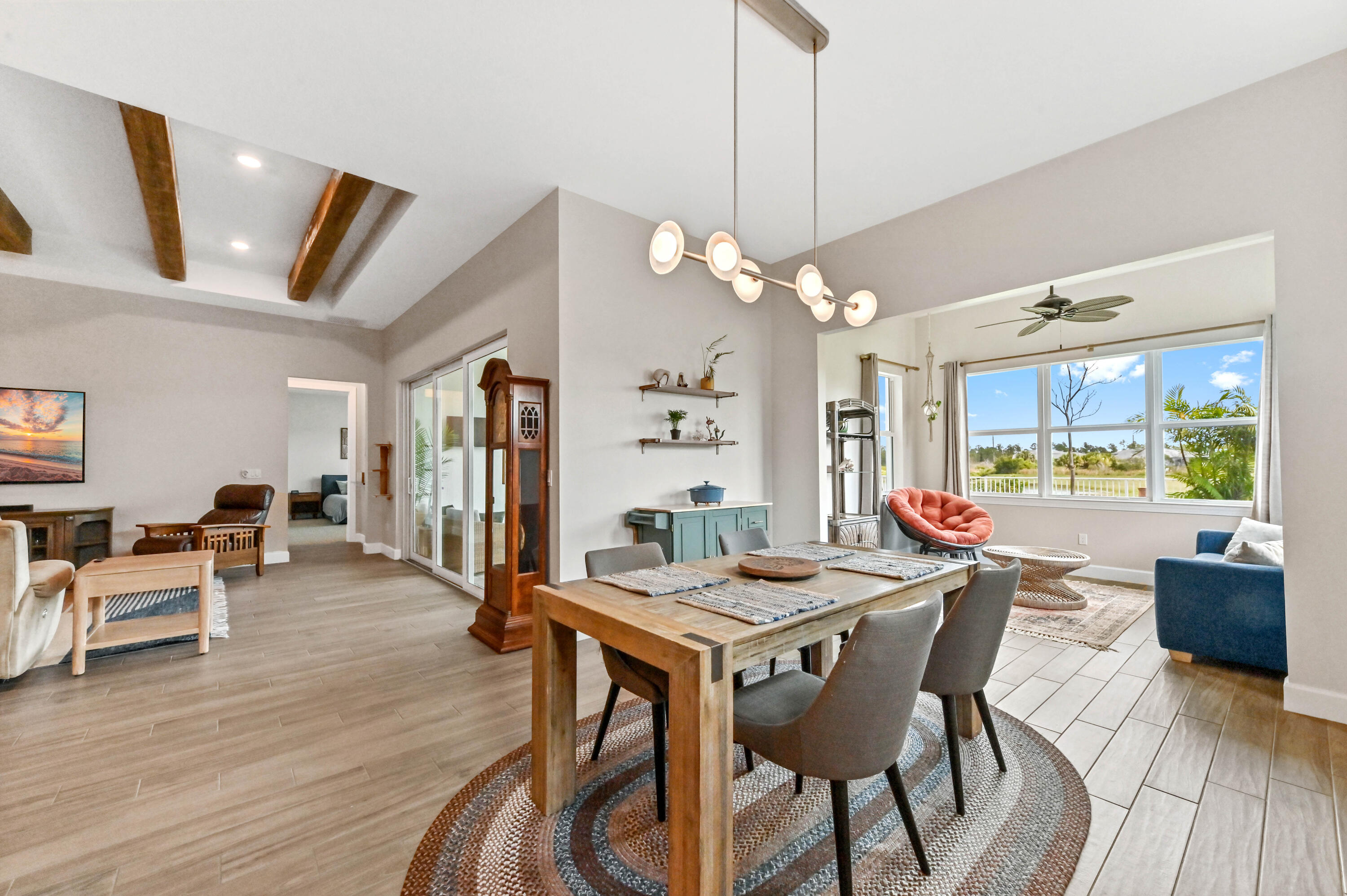 9891 Southwest Legacy Drive Stuart, FL 34997 - Photo 11 of 55 a view of a dining room with furniture window and wooden floor