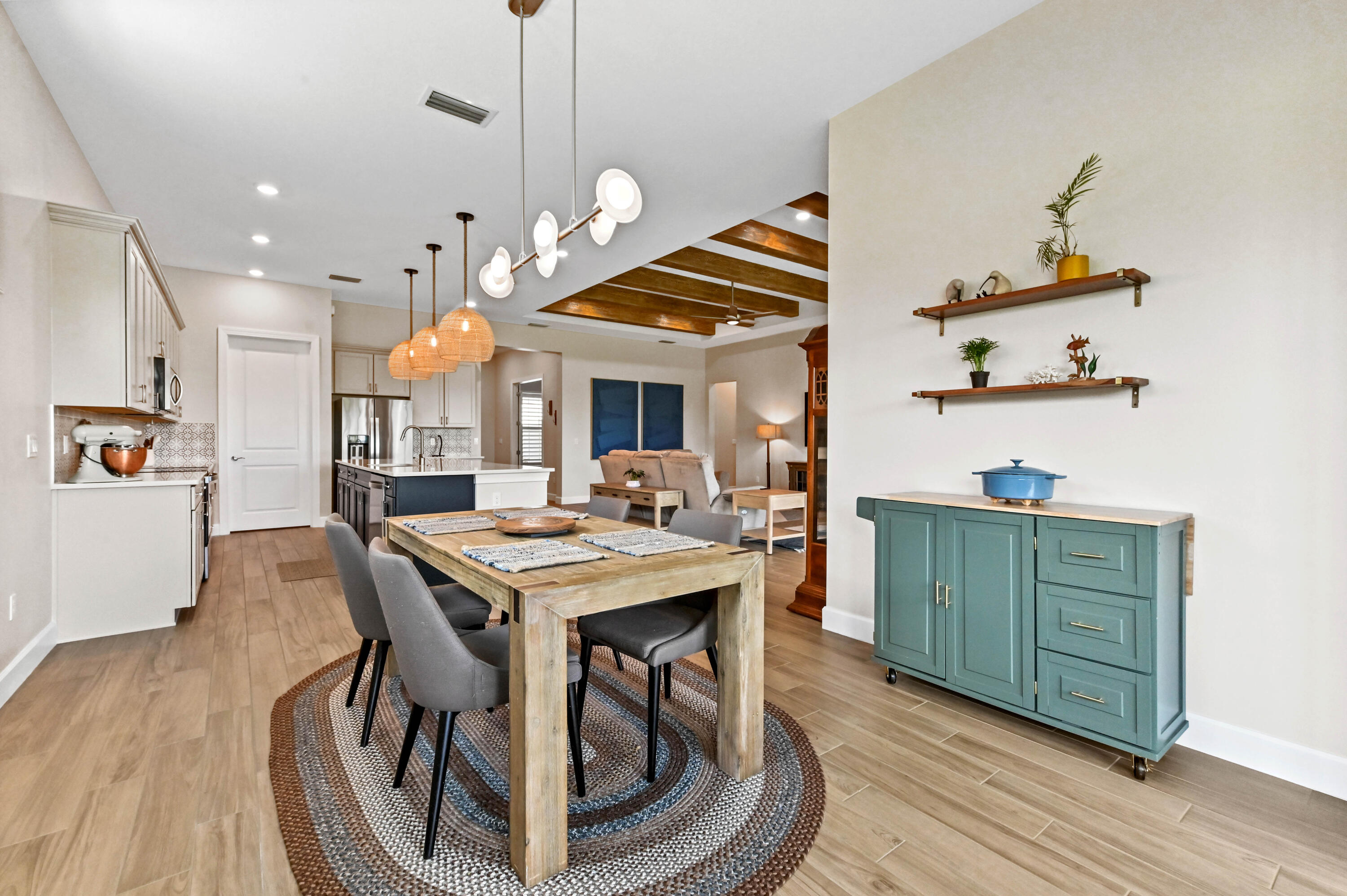 9891 Southwest Legacy Drive Stuart, FL 34997 - Photo 12 of 55 a kitchen with a table and chairs