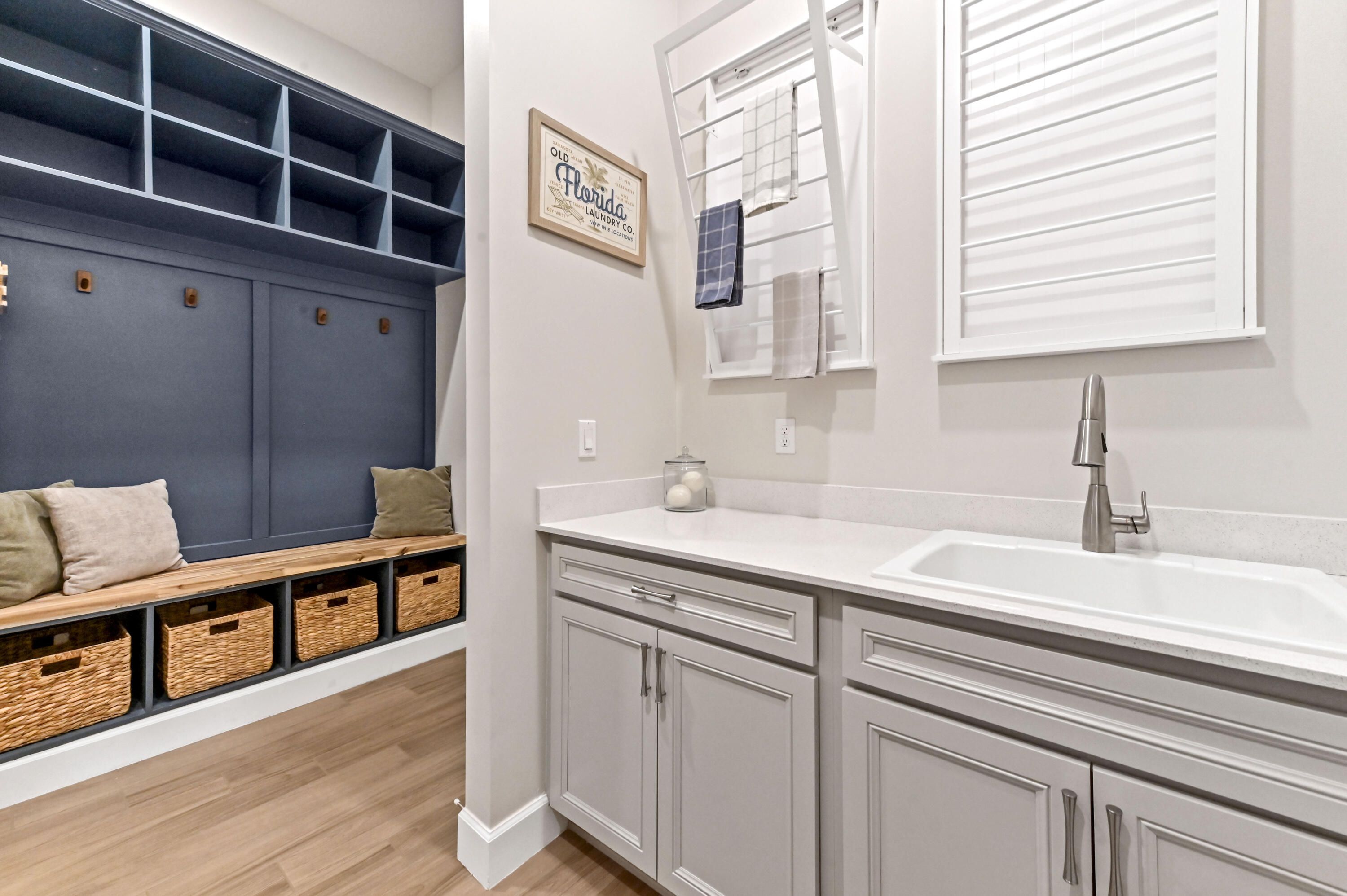 9891 Southwest Legacy Drive Stuart, FL 34997 - Photo 15 of 55 a hallway with cabinets a sink and a window