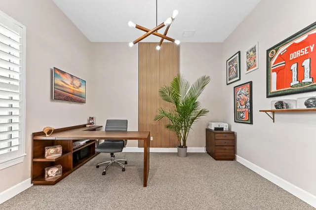 a spacious bedroom with a bed and a couch