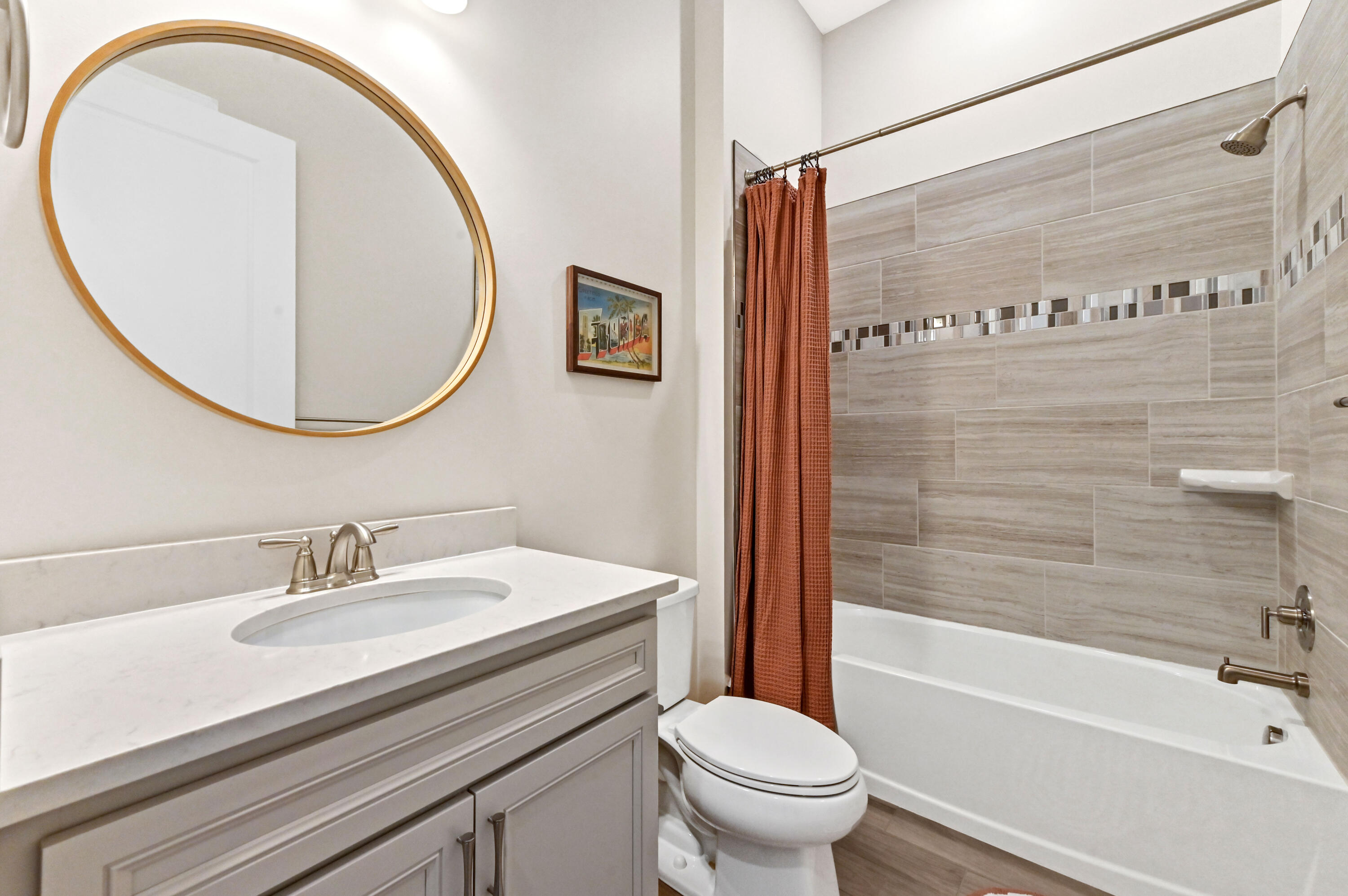 9891 Southwest Legacy Drive Stuart, FL 34997 - Photo 18 of 55 a bathroom with a sink a toilet and a mirror