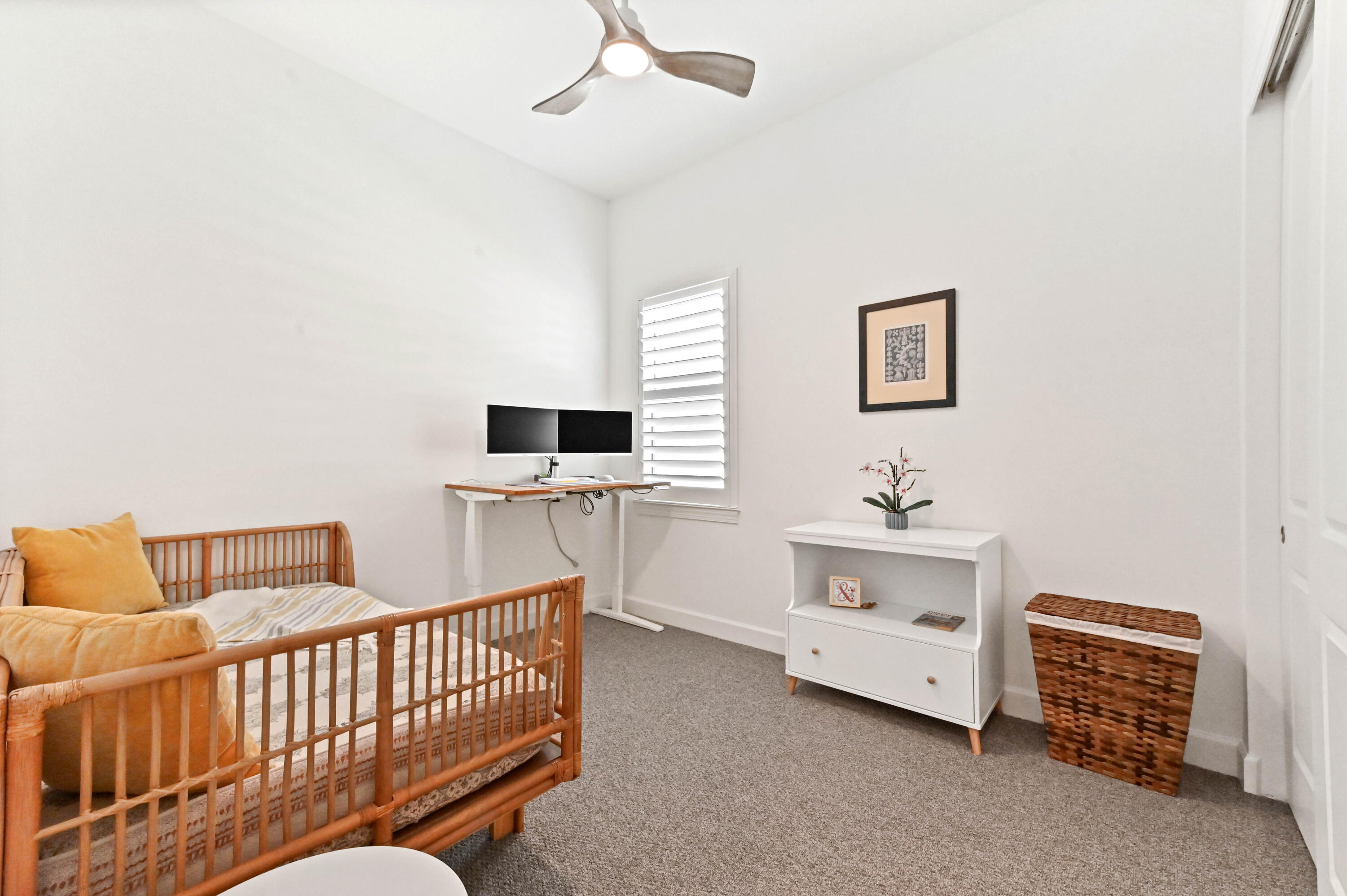 9891 Southwest Legacy Drive Stuart, FL 34997 - Photo 19 of 55 a bedroom with furniture and a window
