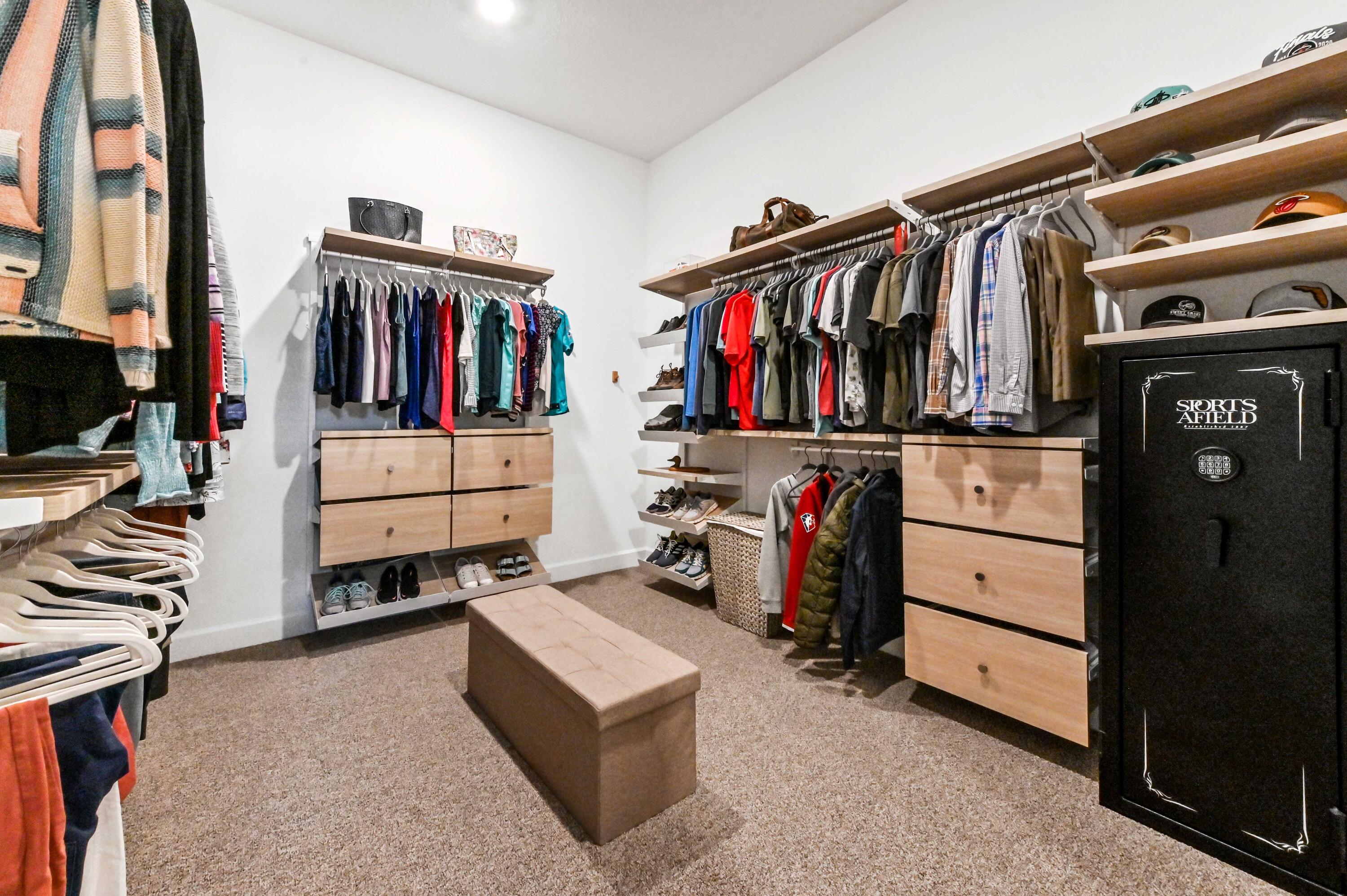 9891 Southwest Legacy Drive Stuart, FL 34997 - Photo 23 of 55 a view of walk in closet with clothes and shoes
