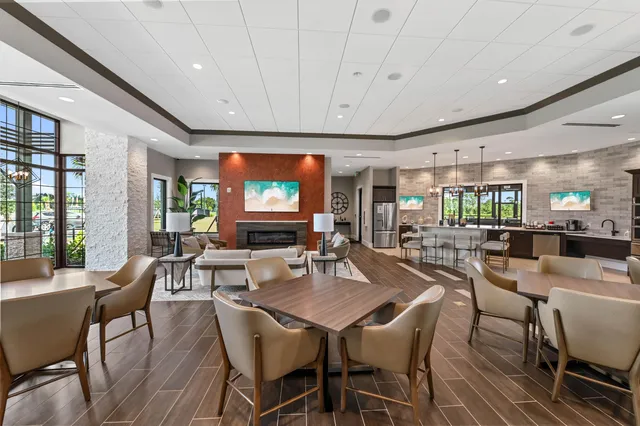 a view of a swimming pool with a table and chairs
