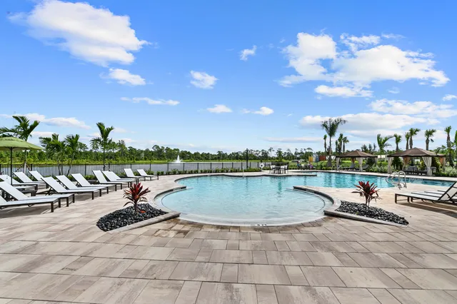 a view of a patio with a dining table and chairs with a patio