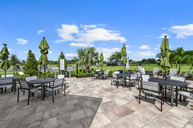 a view of a house with swimming pool and a yard