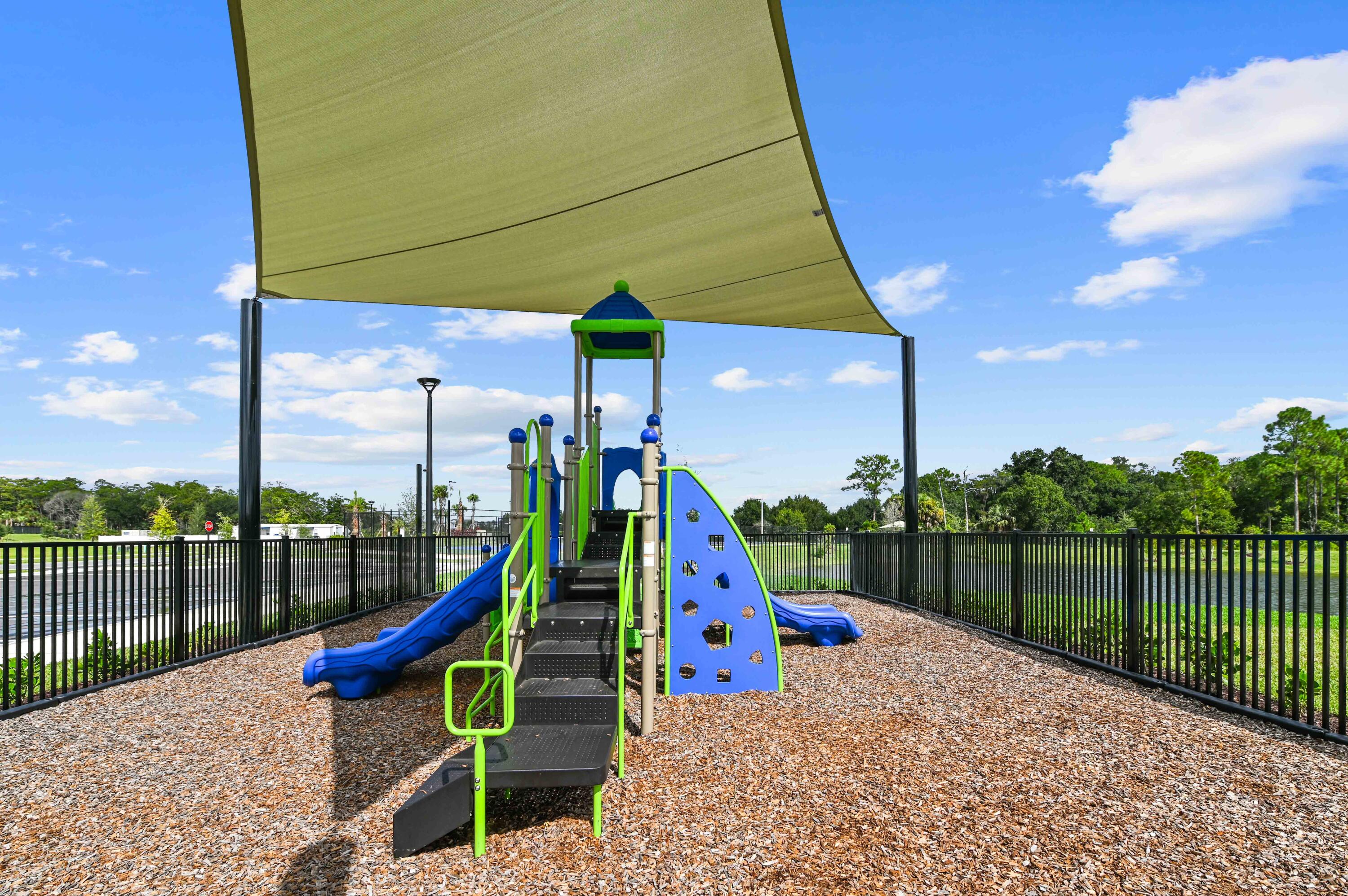 9891 Southwest Legacy Drive Stuart, FL 34997 - Photo 46 of 55 a view of a park with a slide