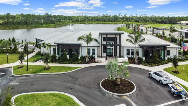a view of a house with garden and pool