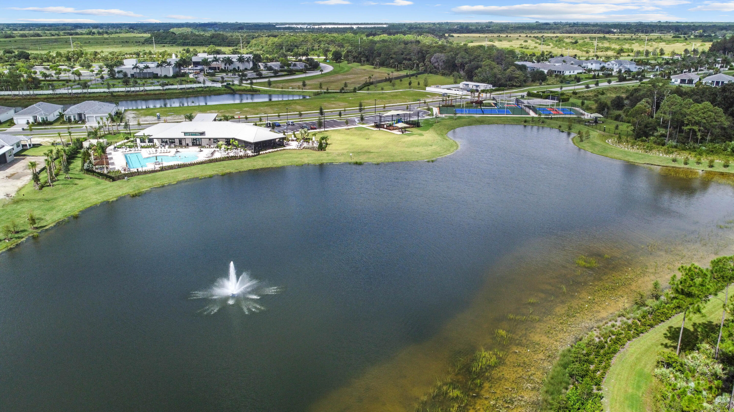 9891 Southwest Legacy Drive Stuart, FL 34997 - Photo 50 of 55 a view of a lake with a mountain view