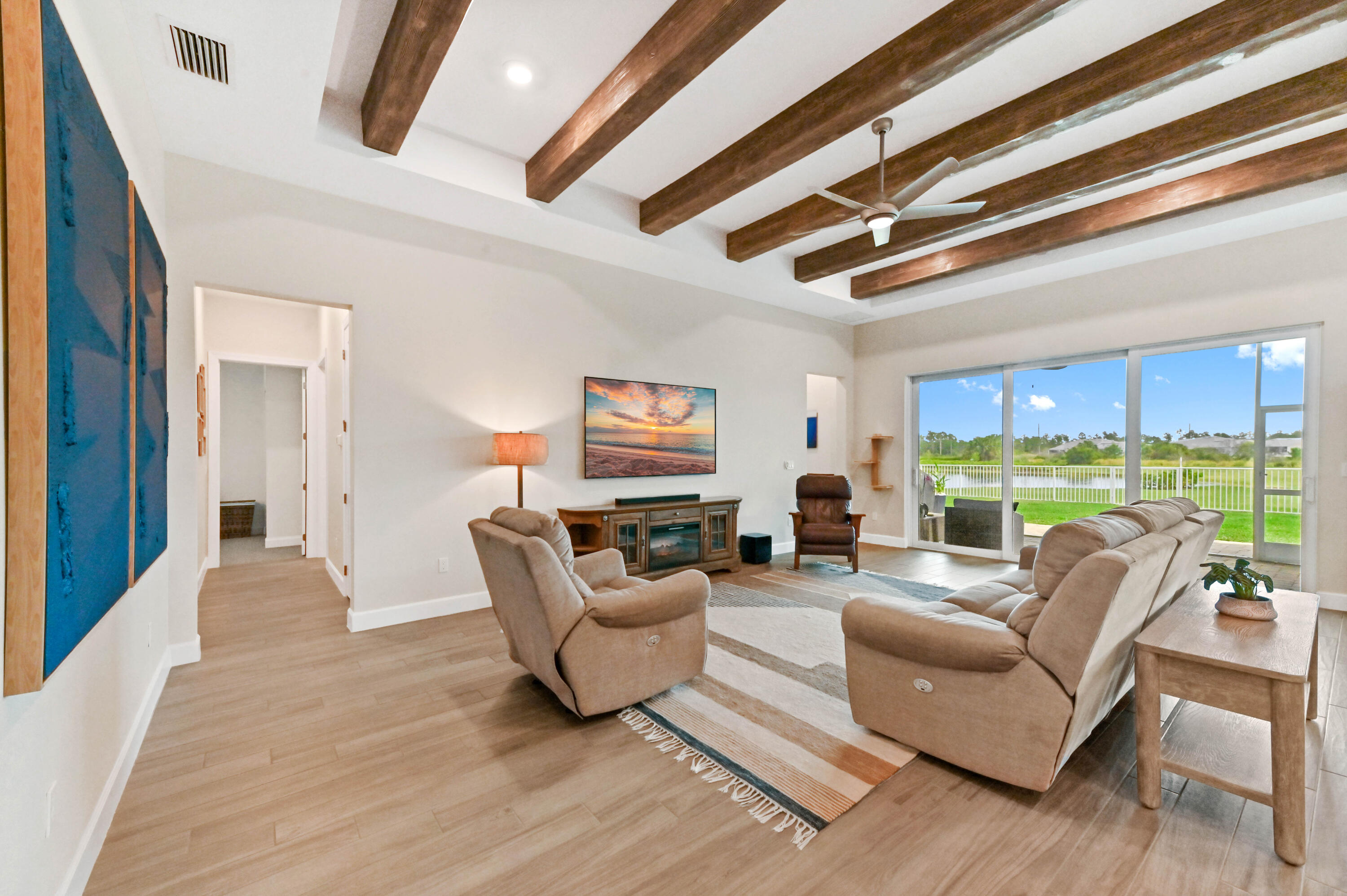 9891 Southwest Legacy Drive Stuart, FL 34997 - Photo 5 of 55 a living room with furniture and a large window