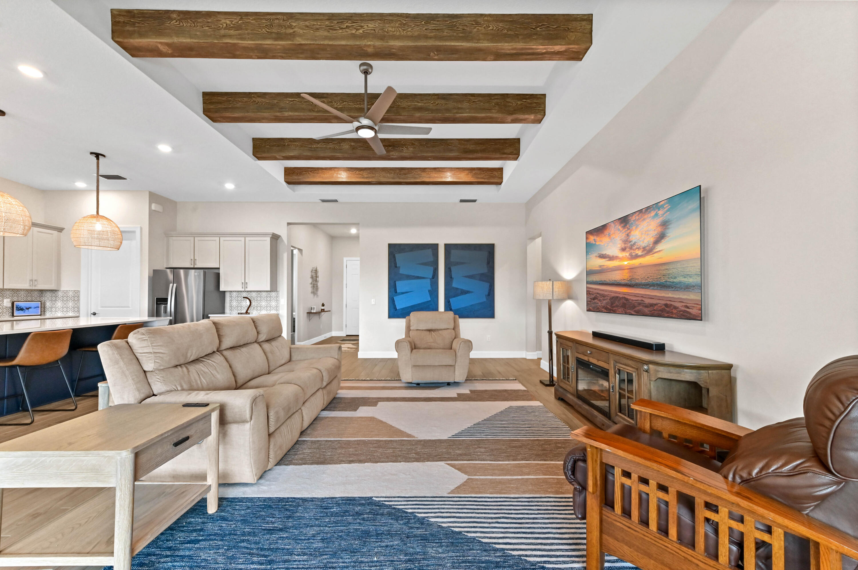 9891 Southwest Legacy Drive Stuart, FL 34997 - Photo 7 of 55 a living room with furniture and a flat screen tv