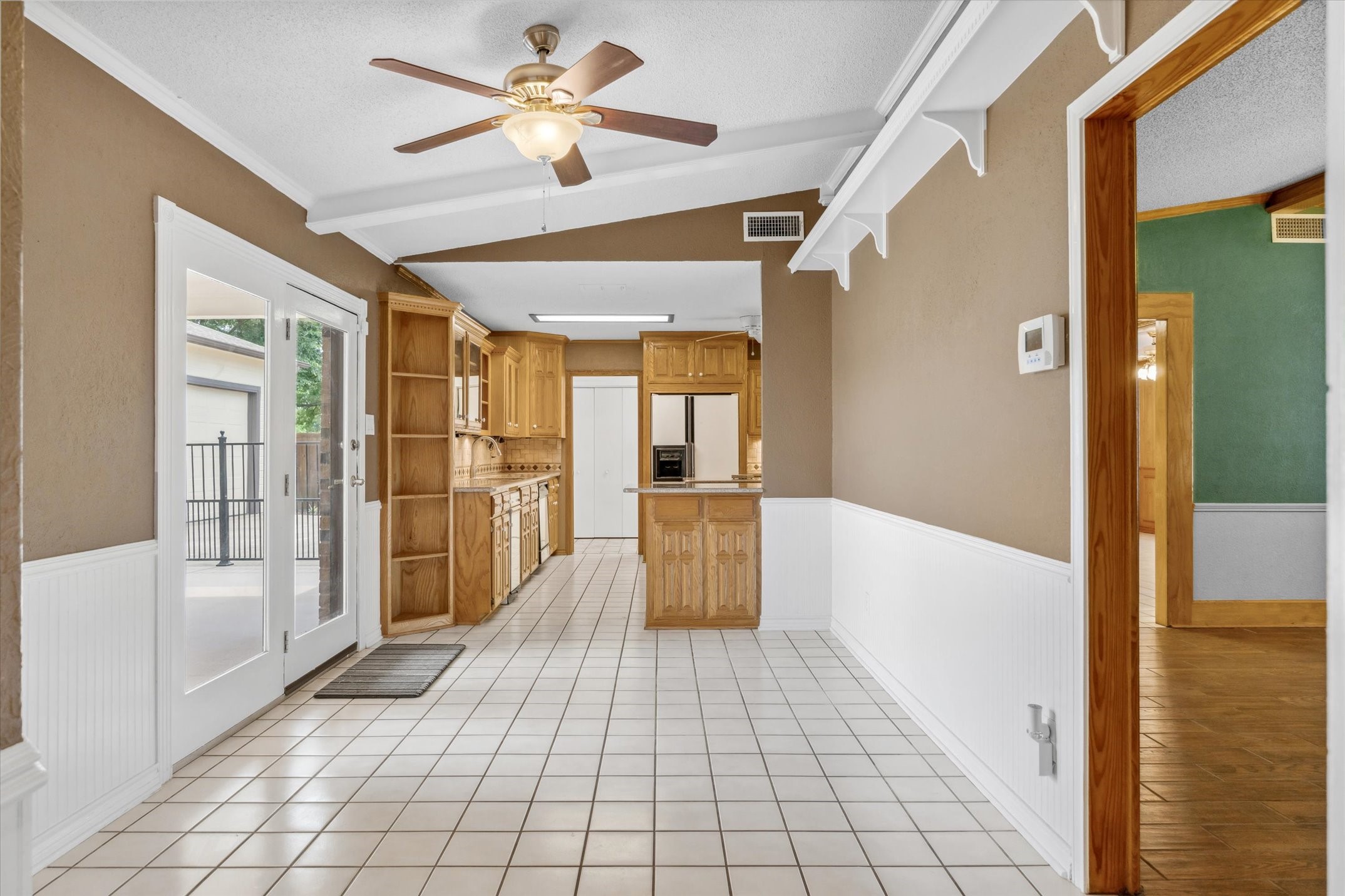 302 Erwin Street Edgewood, TX 75117 - Photo 17 of 40 a large space with a large window and chandelier fan