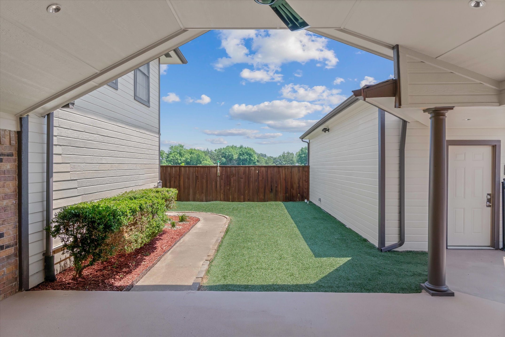302 Erwin Street Edgewood, TX 75117 - Photo 2 of 40 a backyard of a house with lots of green space