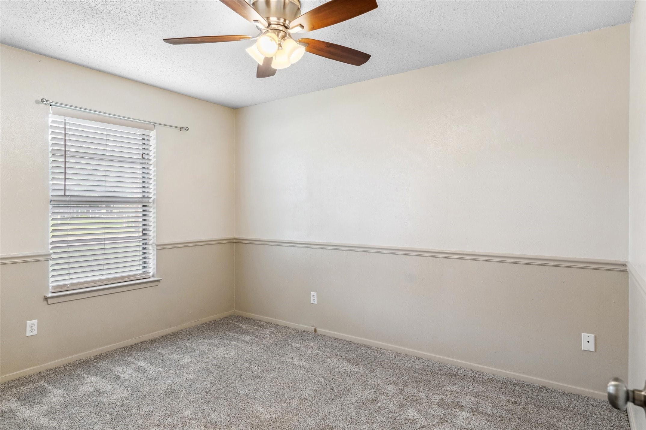 302 Erwin Street Edgewood, TX 75117 - Photo 26 of 40 an empty room with windows and fan