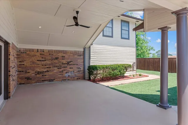 a view of a house with a yard and garage