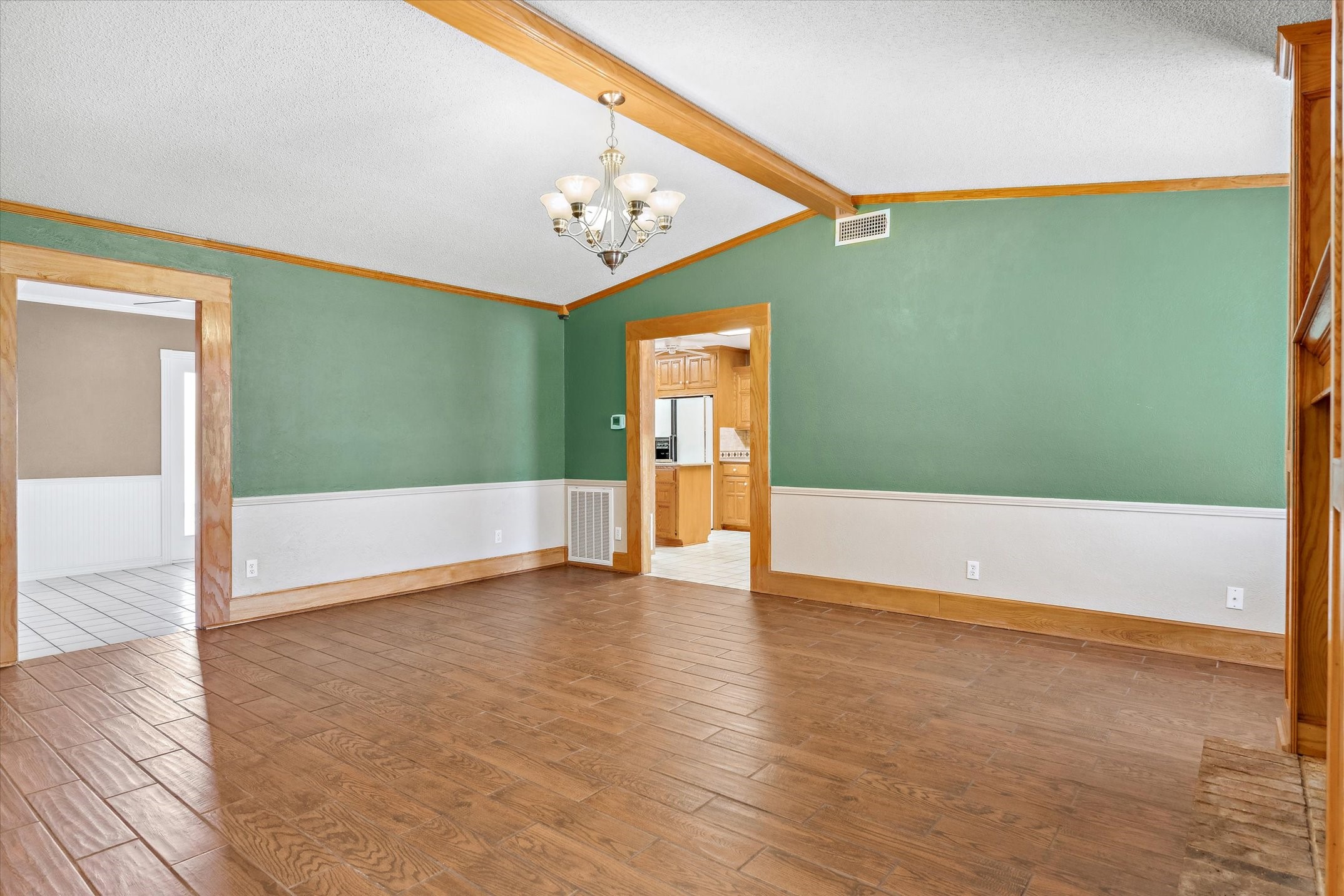 302 Erwin Street Edgewood, TX 75117 - Photo 10 of 40 an empty room with wooden floor and windows
