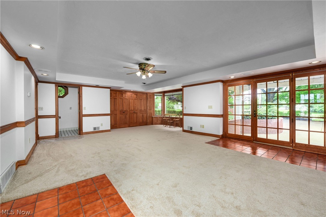 6624 Som Center Road Solon, OH 44139 - Photo 27 of 38 Carpeted empty room featuring ceiling fan and a tray ceiling