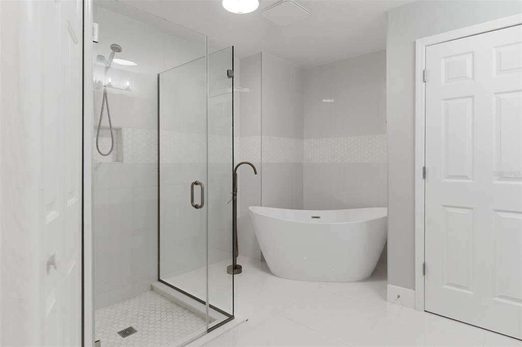 8044 Sandpoint Boulevard Orlando, FL 32819 - Photo 24 of 34 a bathroom with a bathtub and shower