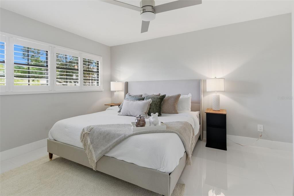8044 Sandpoint Boulevard Orlando, FL 32819 - Photo 27 of 34 a bed room with a bed and a rug