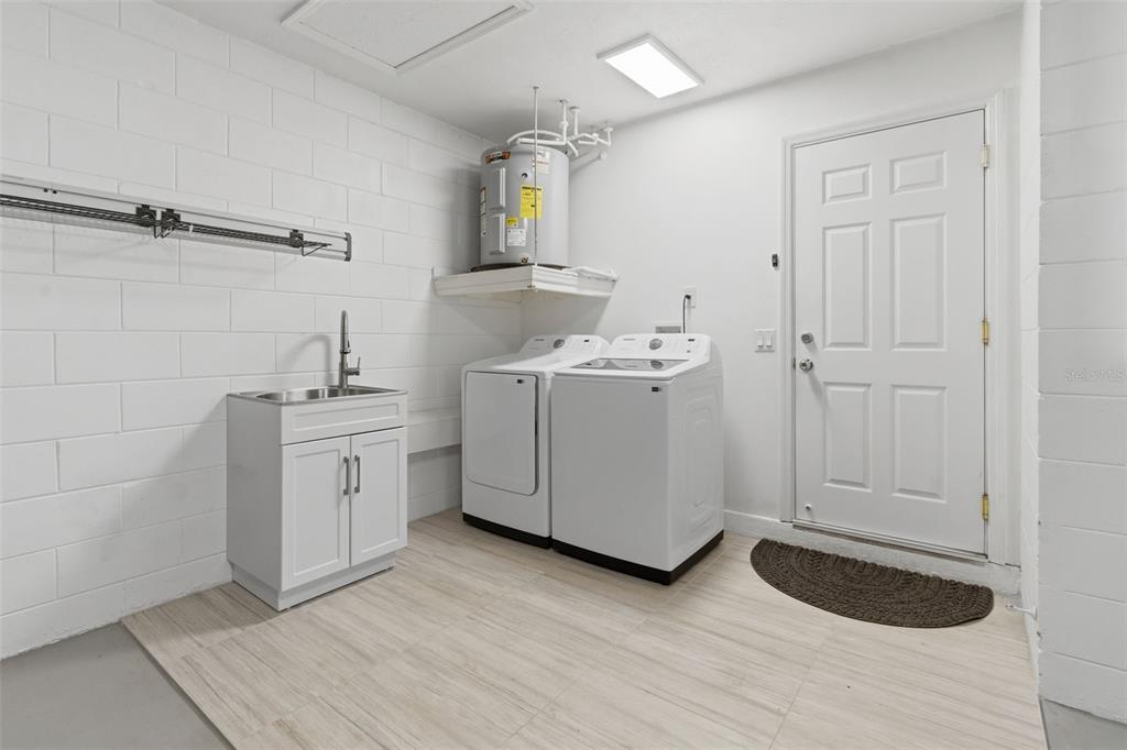 8044 Sandpoint Boulevard Orlando, FL 32819 - Photo 29 of 34 a view of a storage utility room with cabinets