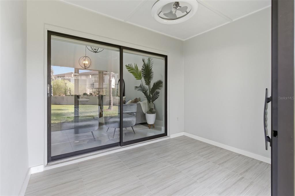 8044 Sandpoint Boulevard Orlando, FL 32819 - Photo 30 of 34 a view of a glass door with wooden floor