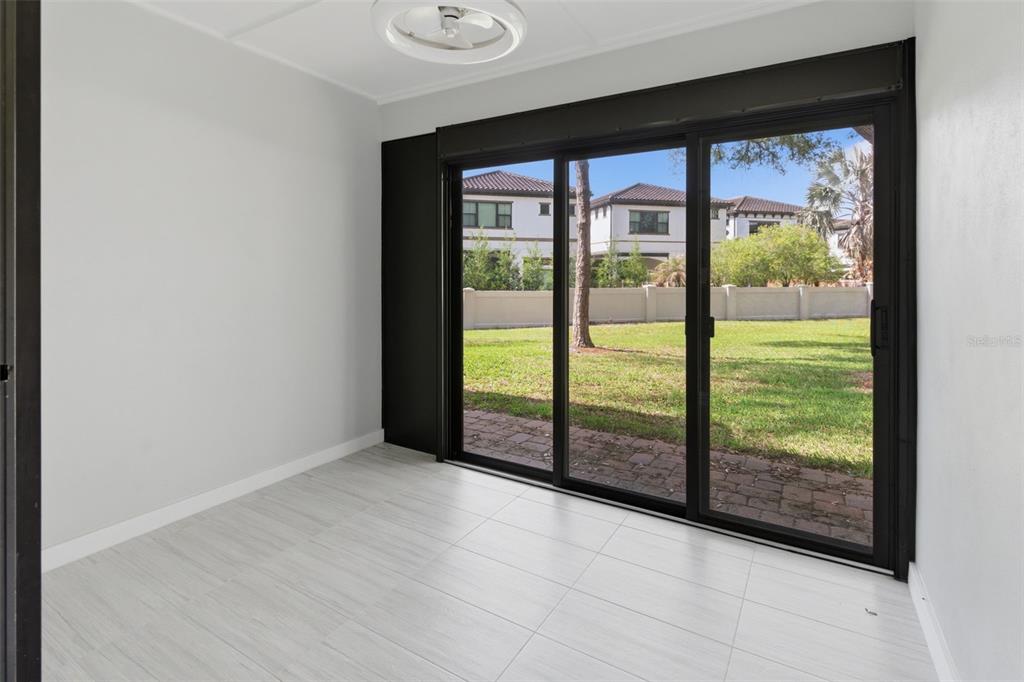 8044 Sandpoint Boulevard Orlando, FL 32819 - Photo 31 of 34 an empty room with large windows