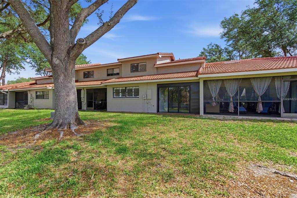 8044 Sandpoint Boulevard Orlando, FL 32819 - Photo 33 of 34 a front view of a house with a garden