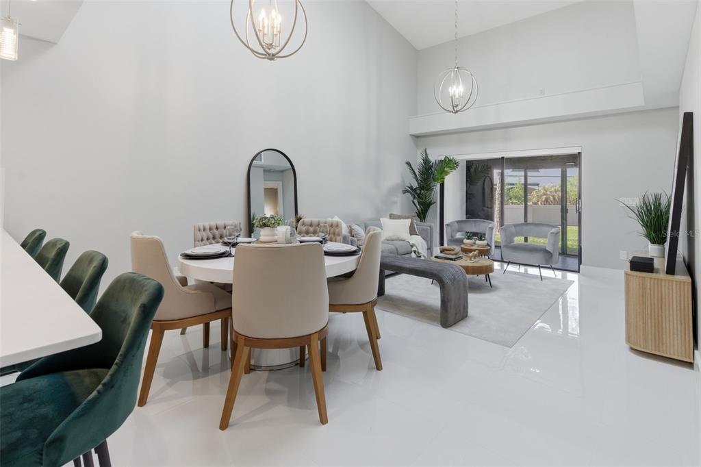 8044 Sandpoint Boulevard Orlando, FL 32819 - Photo 4 of 34 a view of a dining room with furniture and chandelier