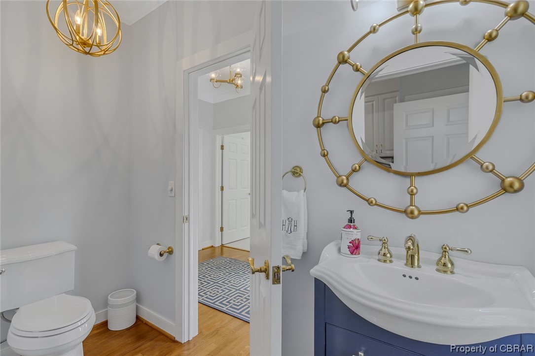 192 Bayberry Point Lane Kilmarnock, VA 22482 - Photo 31 of 49 Bathroom featuring light hardwood flooring, mirror, and vanity