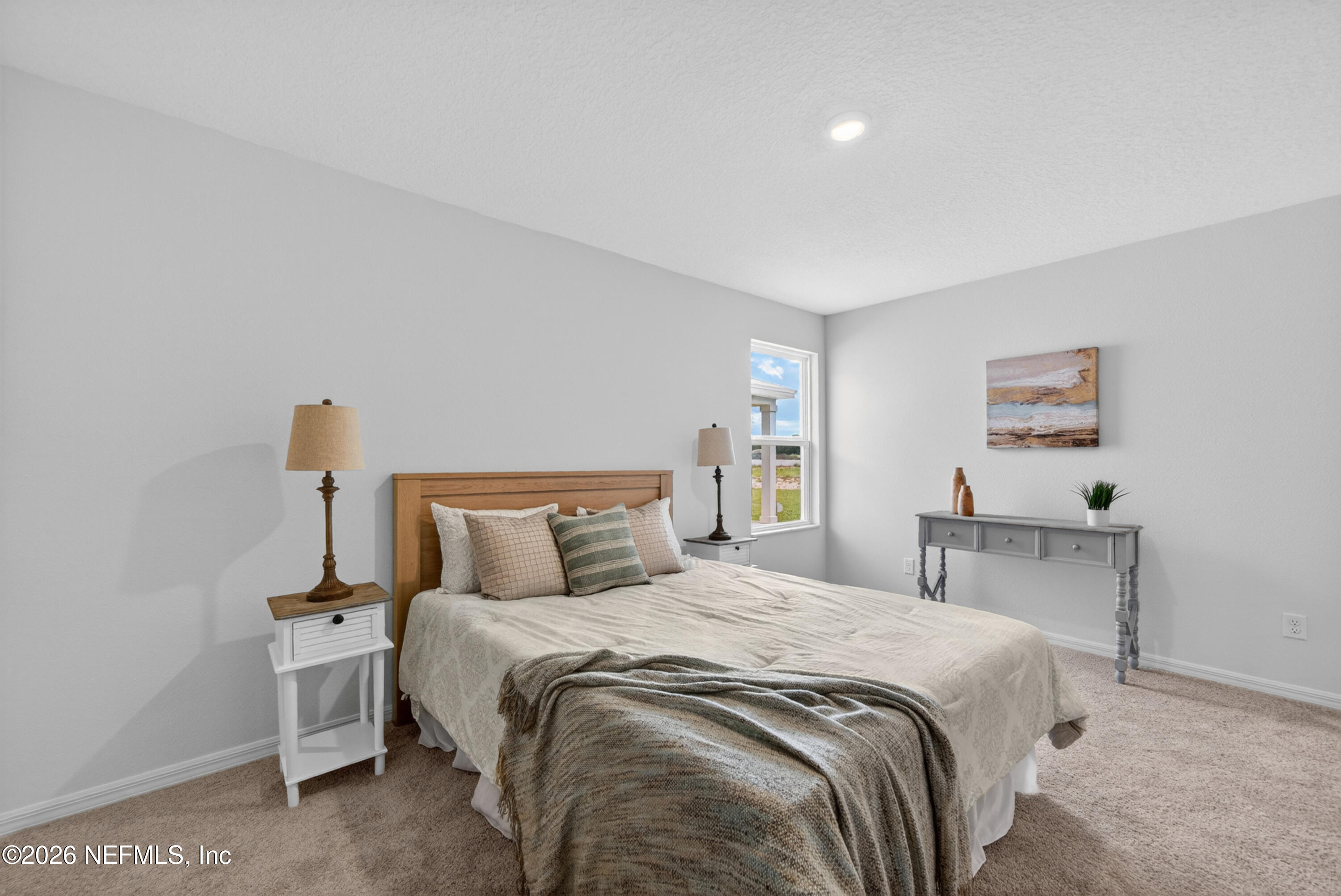 6855 Myrtle Oak Road Jacksonville, FL 32219 - Photo 5 of 27 a bedroom with a bed and a table