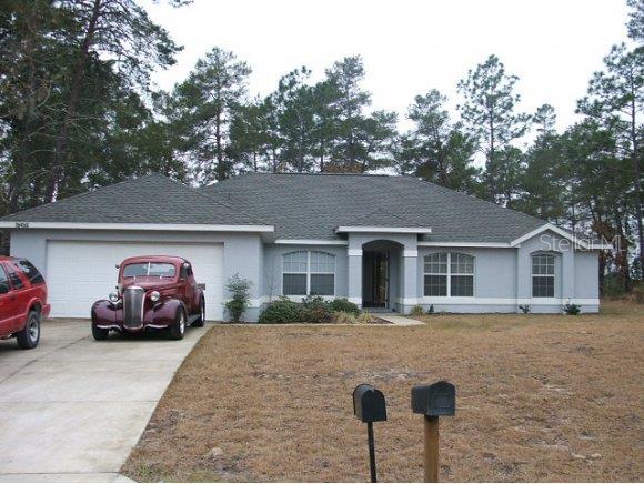 16450 Southwest 55th Court Road Ocala, FL 34473 - Photo 1 of 1 a front view of a house with a yard