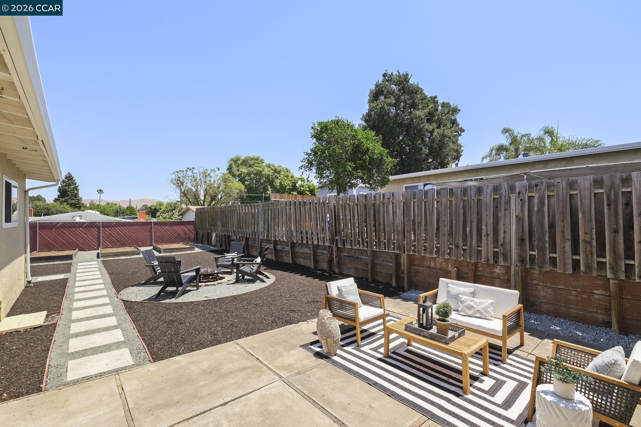 4311 Cowell Road Concord, CA 94521 - Photo 23 of 29 a backyard of a house with table and chairs