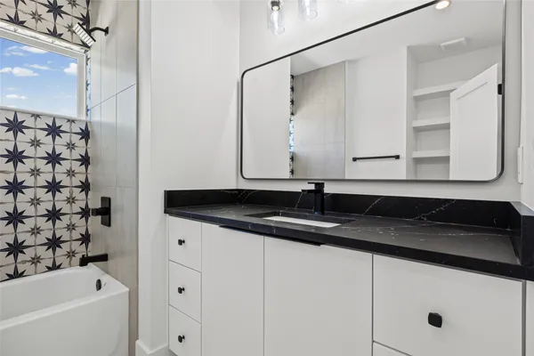 a bathroom with a sink and a bathtub