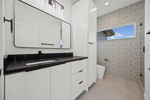a bathroom with a sink and a toilet