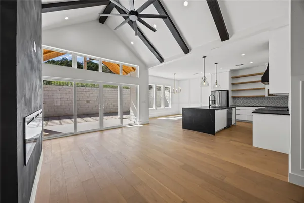 a view of an entryway with wooden floor