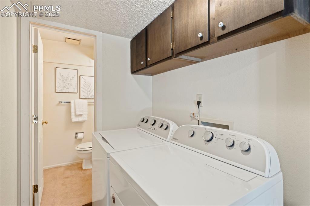 2113 Roundtop Court Colorado Springs, CO 80918 - Photo 15 of 34 a utility room with dryer and washer