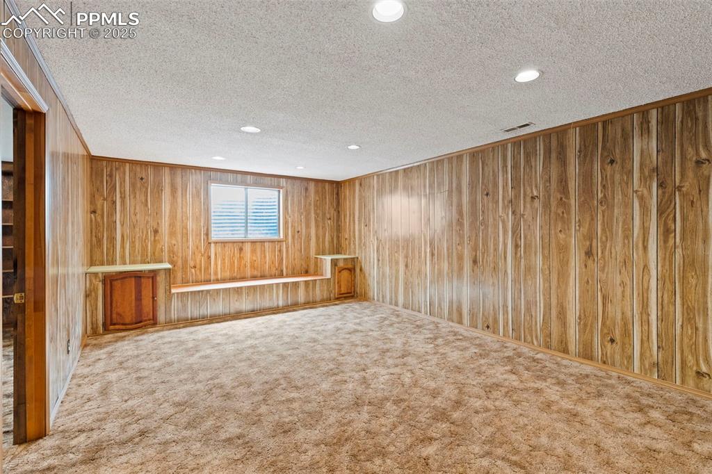 2113 Roundtop Court Colorado Springs, CO 80918 - Photo 25 of 34 a view of an empty room with a window