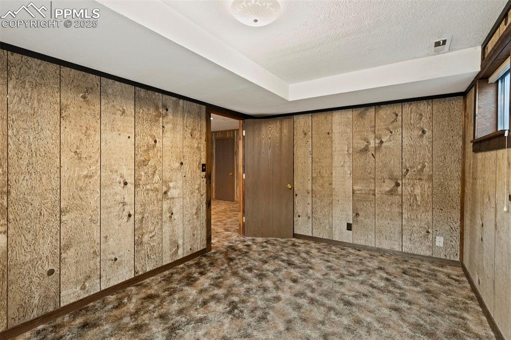 2113 Roundtop Court Colorado Springs, CO 80918 - Photo 28 of 34 a view of a room with wooden walls