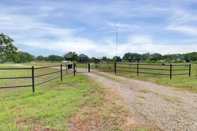 a view of park with wooden fence