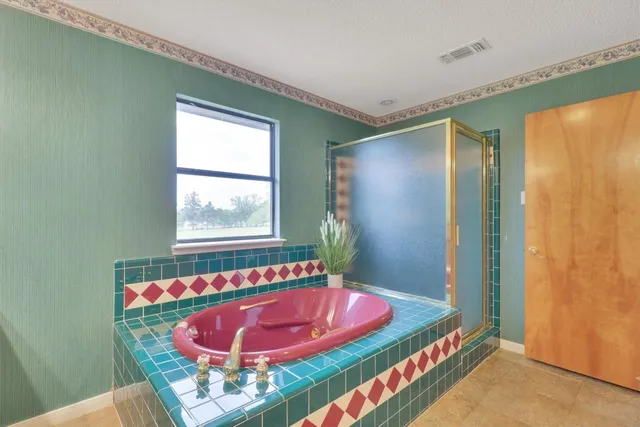 a room with a bed and a dresser in it