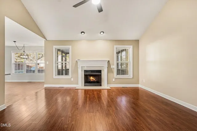 a view of room with window and wooden floor