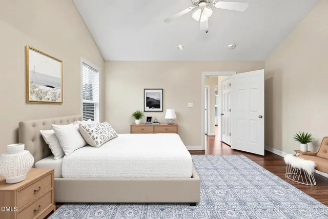 a bathroom with a double vanity sink toilet and a tub