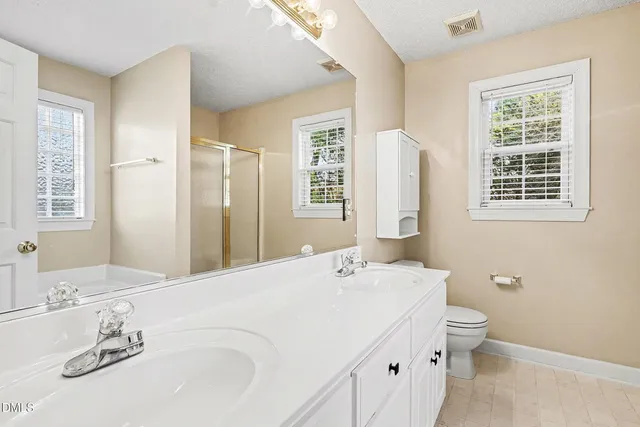 a view of an empty room and wooden floor