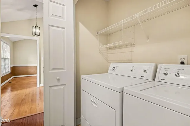 a view of a house with swimming pool and sitting area
